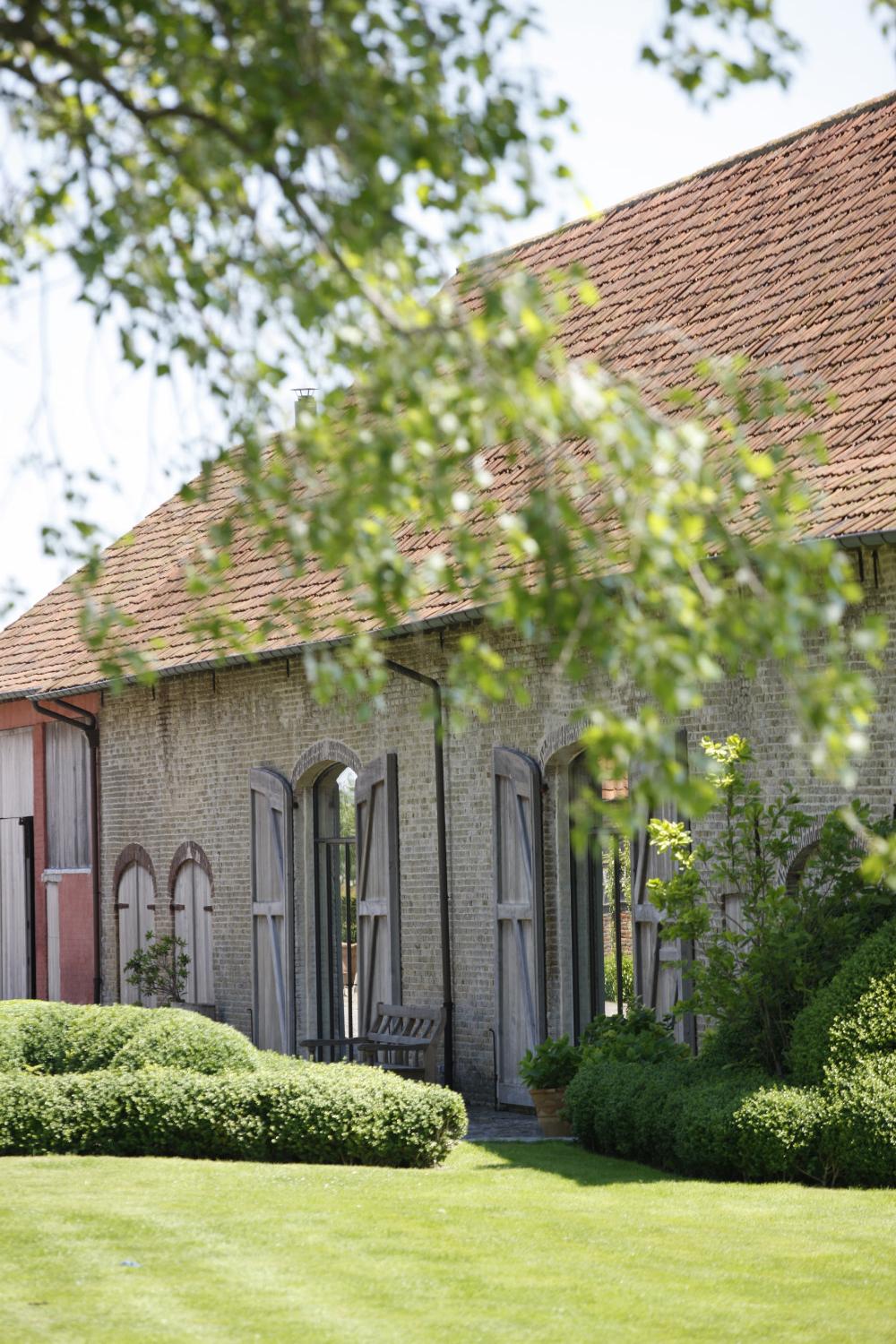 Historic buildings and garden beauty shine at The Little Monastery, a wonderful B&B near Bruges. Come enjoy photos and a tour of Belgian Design Style Inspiration from antiques dealers Alain and Brigitte Garnier.