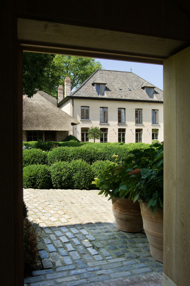 Breathtaking architecture and boxwood gardens at The Little Monastery, a wonderful B&B near Bruges. Come enjoy photos and a tour of Belgian Design Style Inspiration from antiques dealers Alain and Brigitte Garnier.