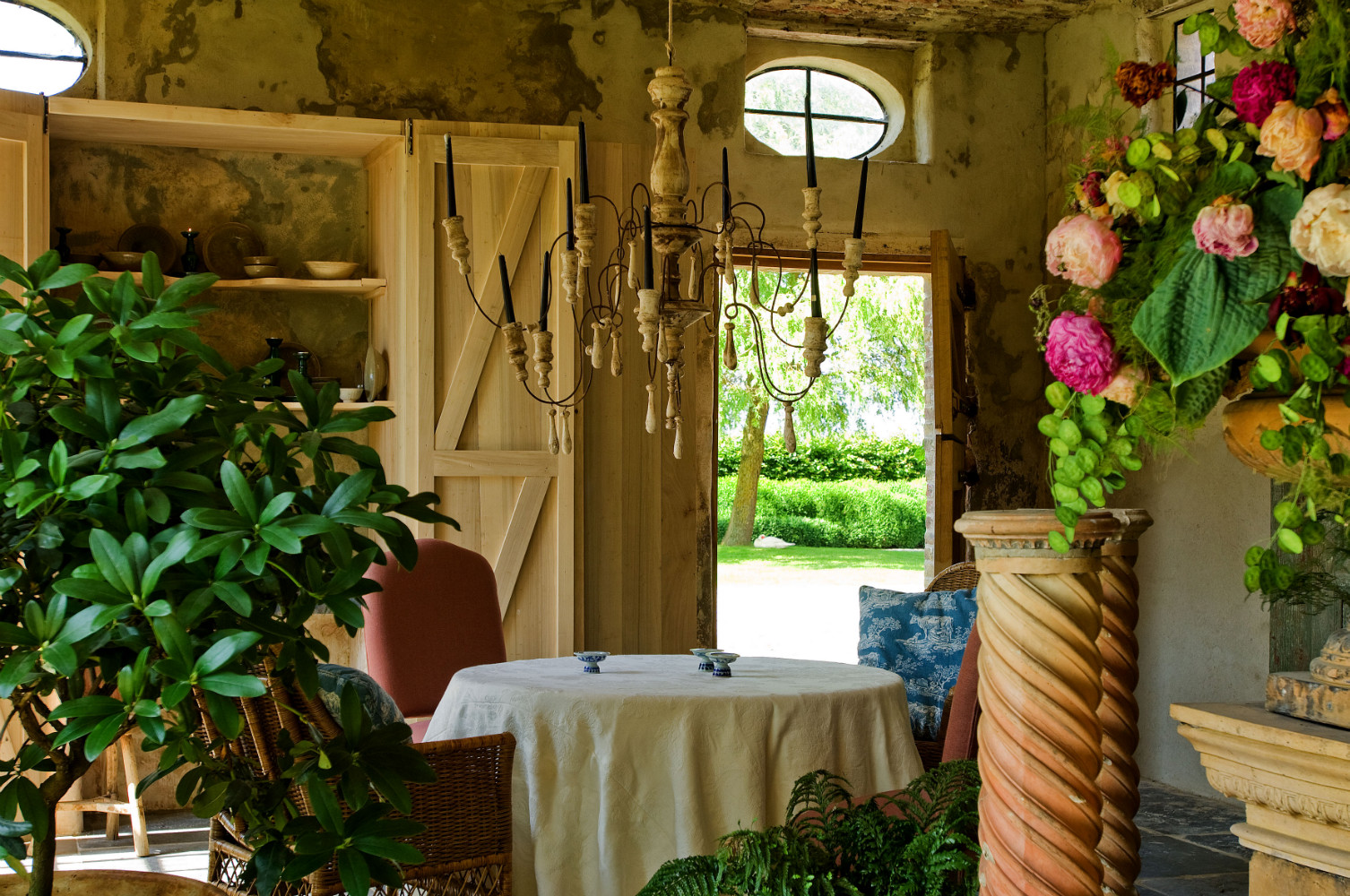 Glowing with warmth, this rustically refined dining area with candle style chandelier sings with beauty at The Little Monastery, a wonderful B&B near Bruges. Come enjoy photos and a tour of Belgian Design Style Inspiration from antiques dealers Alain and Brigitte Garnier.